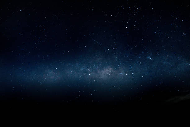 istock The stardust in dark night in blue color. 1202207857