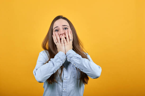 istock Surprised caucasian lady covered mouth with hands, shocked. 1202208220