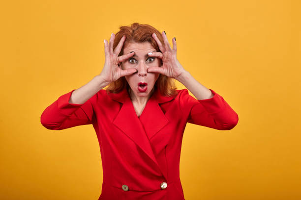 istock Shocked young woman opened eyes with hands, keeping mouth opened 1202208911