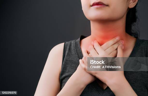 Beautiful Asian Woman Feeling Unwell On Her Sore Throat And Hard To Swallow That Was Sick From Cold And Flu Adult Women Suffering From Gland Inflammation Throat Pain Sickness Gland Inflammation Healthcare And Medical Stock Photo - Download Image Now