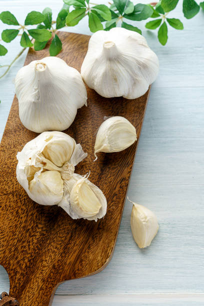 istock Garlic on wooden background 1202211828