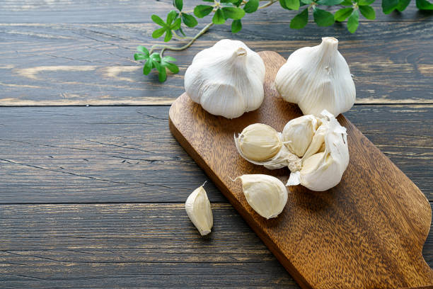 istock Garlic on wooden background 1202211899