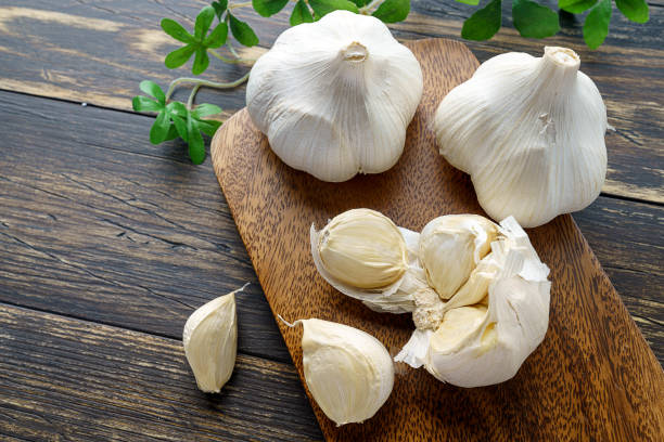 istock Garlic on wooden background 1202211925