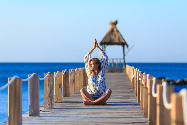 istock Workout on wooden pier 1202213530