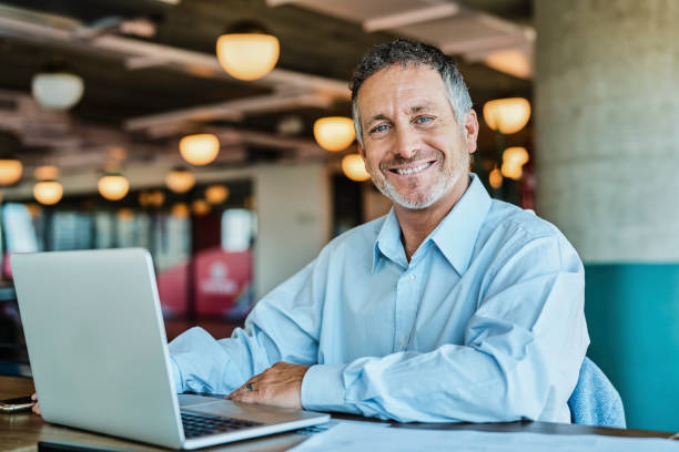 istock Confident businessman at coworking space 1202214644