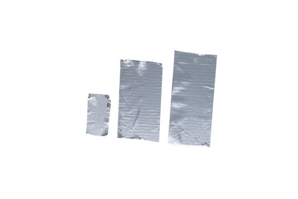 istock Silver scotch tape pieces isolated on white background. 1202216023