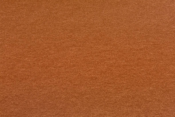 istock Abstract brown paper background in beige tan color. 1202218648