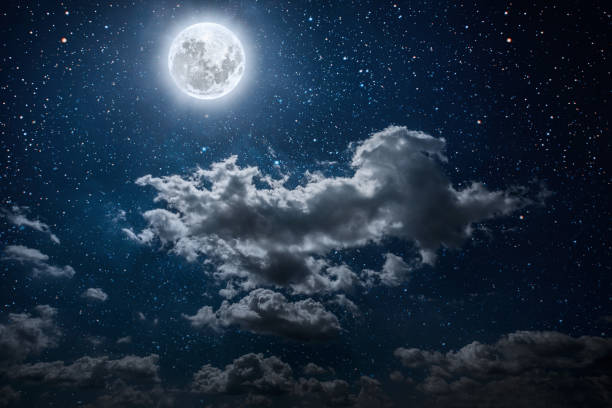 istock a backgrounds night sky with stars and moon and clouds. 1202218893