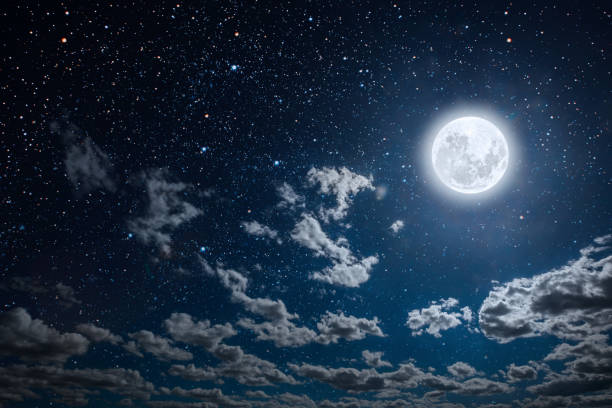 istock a backgrounds night sky with stars and moon and clouds. 1202218938