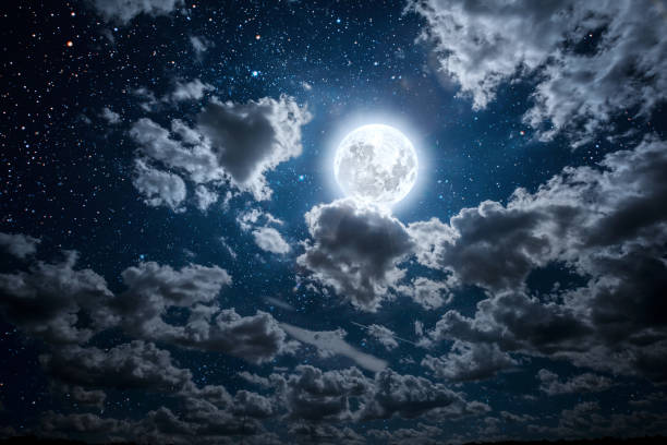 istock a backgrounds night sky with stars and moon and clouds. 1202218987