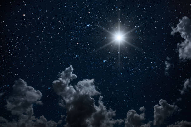 istock backgrounds night sky with stars and moon and clouds. 1202219042