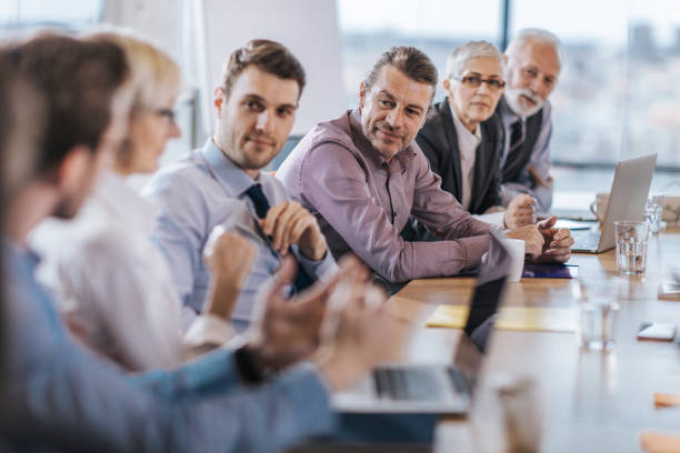 istock Business team talking on a meeting in a board room. 1202219211