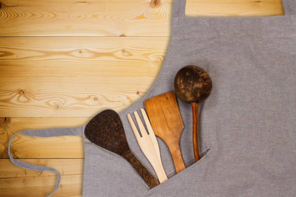 istock Kitchen utensils in pocket of apron 1202220724