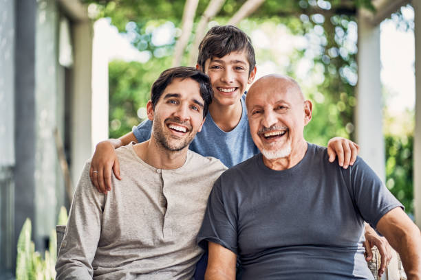 porträt einer glücklichen mehrgenerationenfamilie auf der terrasse - grandparent multi generation family grandfather child stock-fotos und bilder