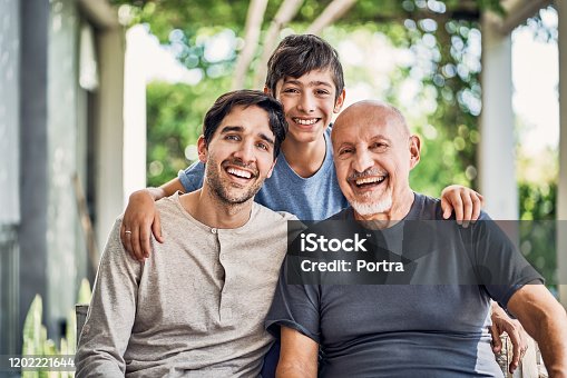 istock Portrait of happy multi-generation family at patio 1202221644