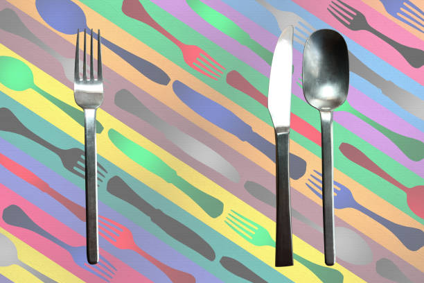 istock Cutlery placed on a table set decorated with a spoon fork and knife 1202222315