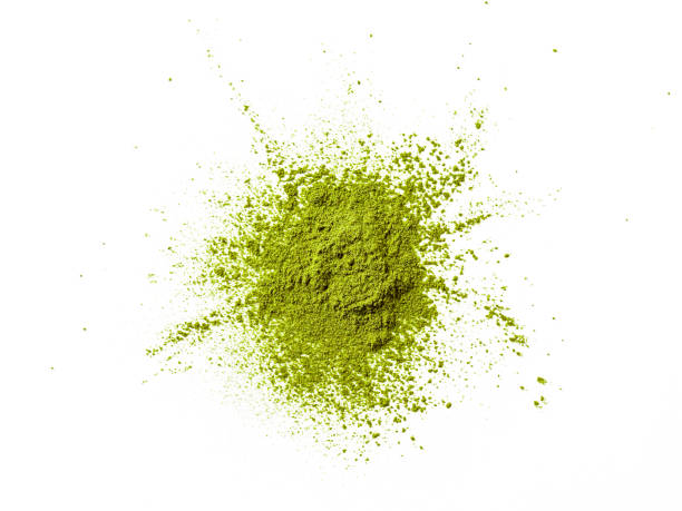 istock Green matcha tea powder explosion,white background 1202223177