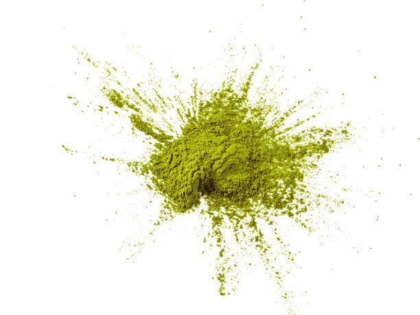 istock Green matcha tea powder explosion,white background 1202223201