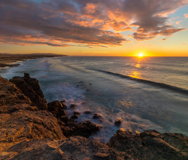 istock Beautiful sunset over the ocean cliff 1202223470