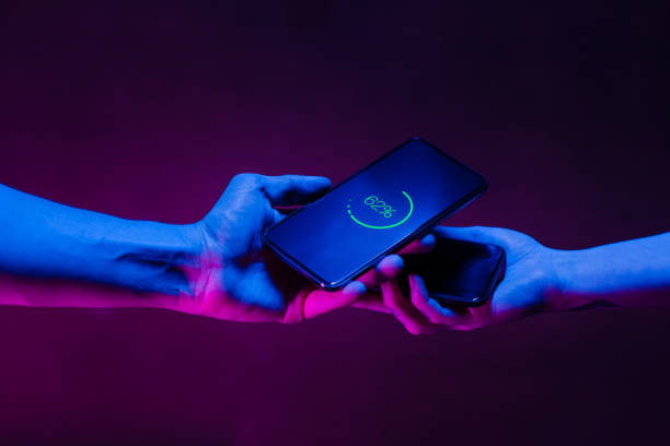 istock Sharing energy with wireless battery charging between two smart phones 1202224914