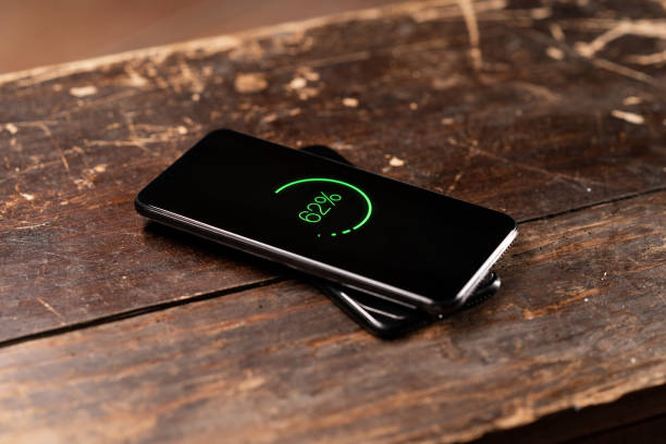 istock Sharing energy with wireless battery charging between two smart phones 1202224933