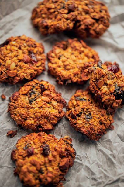 istock Freshly baked breakfast cookies served on baking paper 1202225289