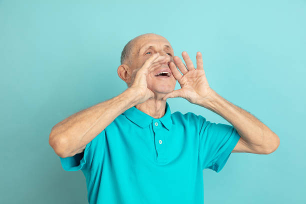 istock Caucasian senior man's portrait isolated on blue studio background 1202225350