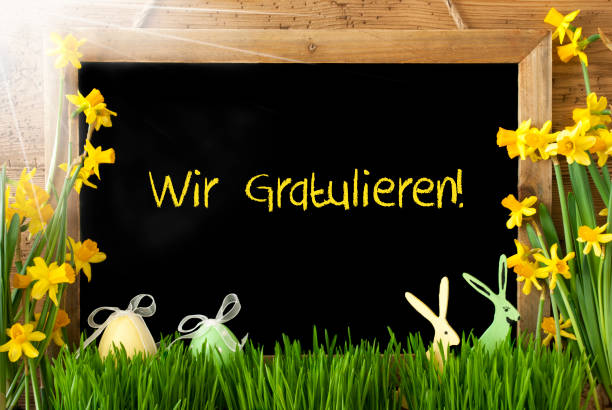 istock Sunny Narcissus, Easter Egg, Bunny, Wir Gratulieren Means Congratulations 1202226557