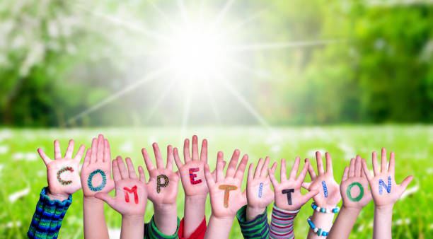 istock Children Hands Building Word Competition, Grass Meadow 1202226736
