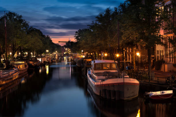 istock Amsterdam canal view at sunset 1202228671