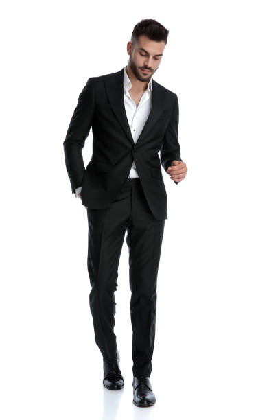 istock businessman walking with hand in pocket and looking down upset 1202231584