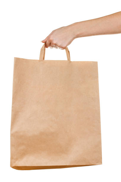 istock Hand with paper bag on white 1202231777