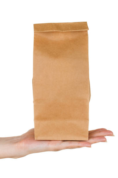 istock Female palm with a paper bag 1202231787