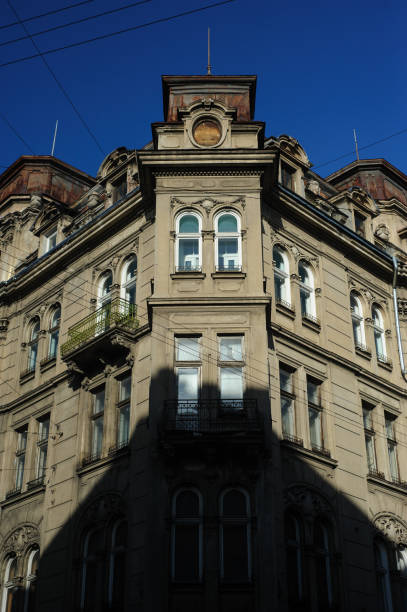 istock Building facade. Old building exterior with windows and lanterns. Historic building structure. Architectural structure. Urban architecture and construction. City building. Town house. 1202232149