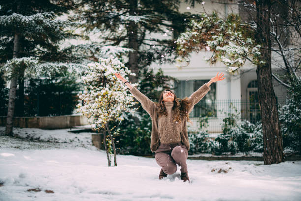 Cute Woman Playing With Snow
