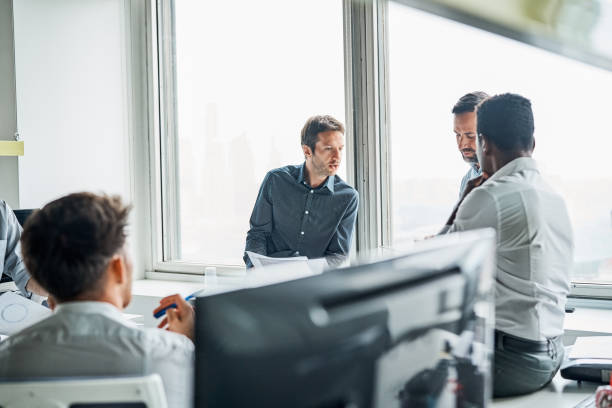 istock Businessmen discussing in meeting at office 1202233058