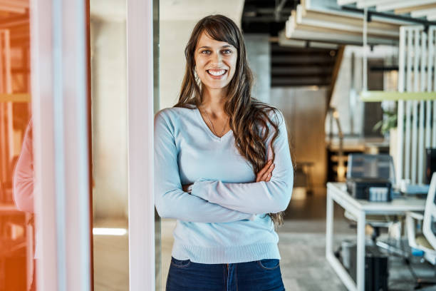 istock Confident businesswoman standing in office 1202234708