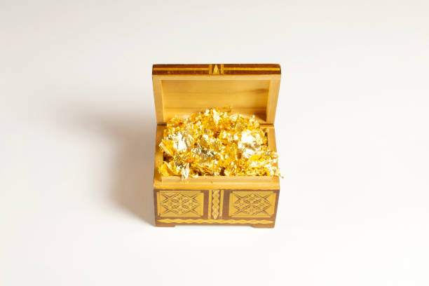 istock Opened single casket with golden foil as gold inside isolated on white with soft shadows, wooden box, wooden chest, treasure chest. 1202234898
