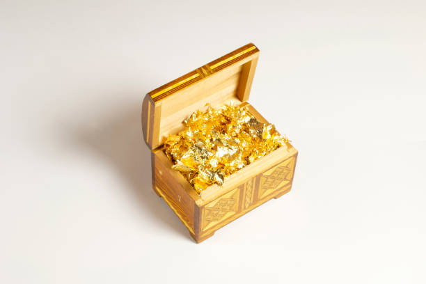 istock Opened single casket with golden foil as gold inside isolated on white with soft shadows, wooden box, wooden chest, treasure chest. 1202235306