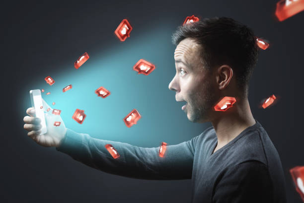 istock Man getting lots of social media likes 1202236249