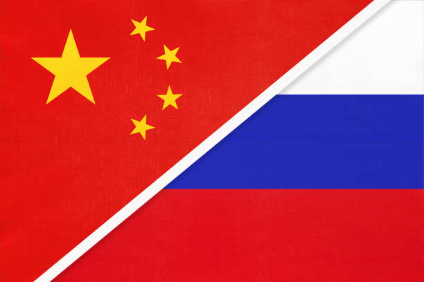 istock China or PRC vs Russia national flag from textile. Relationship between asian and european countries. 1202241644