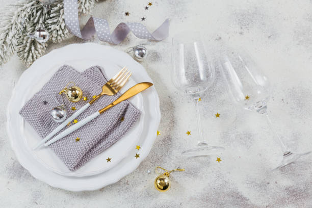 istock Christmas table place setting and winter holiday decorations 1202242358