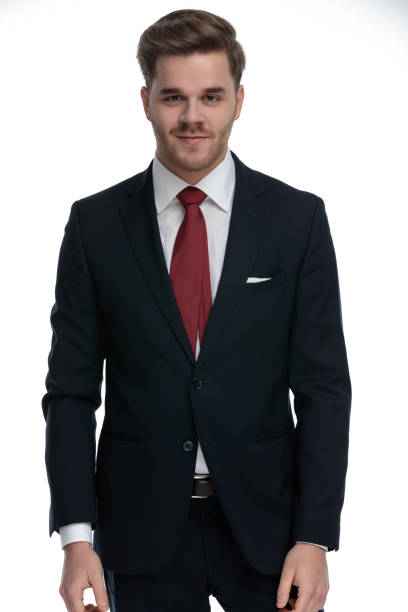 istock elegant young businessman wearing suit and smiling 1202242571