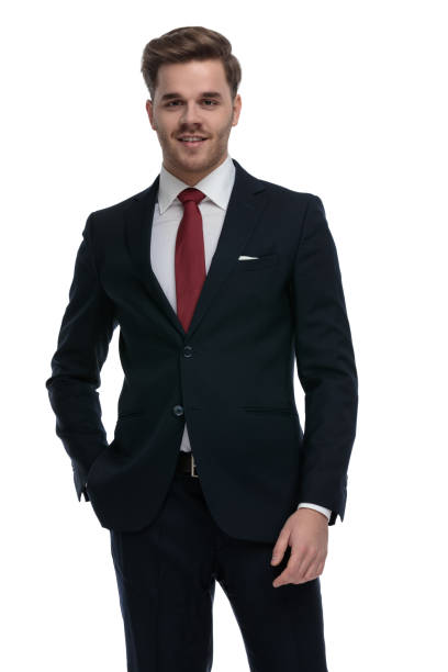 istock young businessman holding hands in pockets and smiling 1202242625