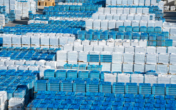 Industry warehouse outdoor with sealed packs stacked in a row Industry warehouse outdoor with sealed packs stacked in a row perspective aerial pallet industrial equipment stock pictures, royalty-free photos & images