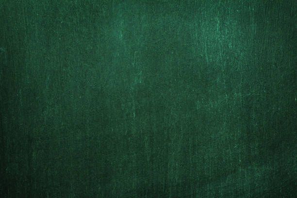 Dark green wall texture in irish style. Background for text and decor. Dark green wall texture for a designer background. Artistic plaster of a rough wooden surface with dark night lighting green painted wood texture stock pictures, royalty-free photos & images