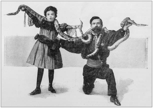 Antique photo: Snake charming