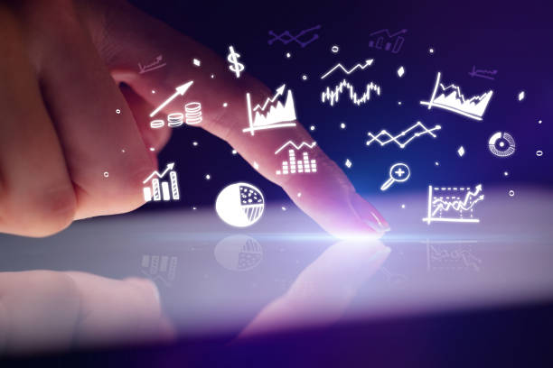 istock Finger touching tablet with reports and charts above 1202243034