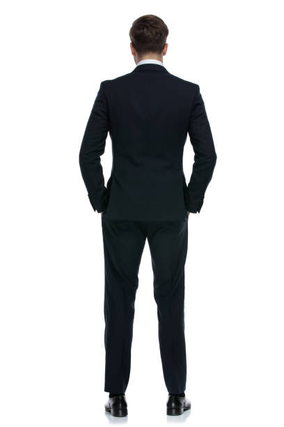 istock elegant businessman in suit holding hands in pocket 1202243101