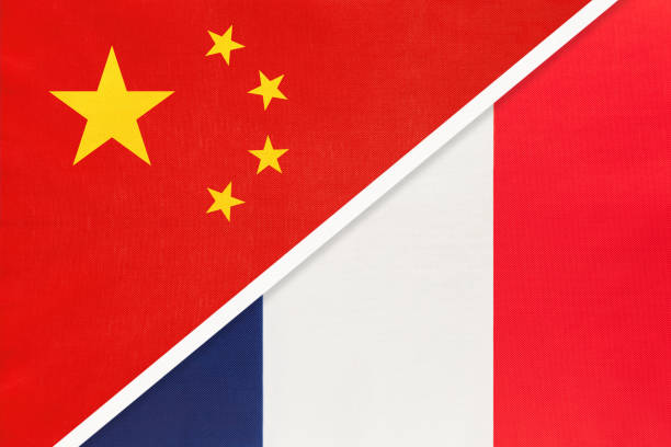 istock China or PRC vs France national flag from textile. Relationship between asian and european countries. 1202244415